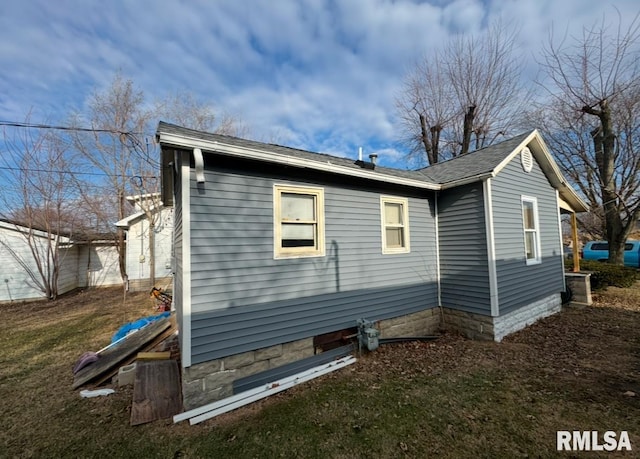 view of home's exterior with a yard