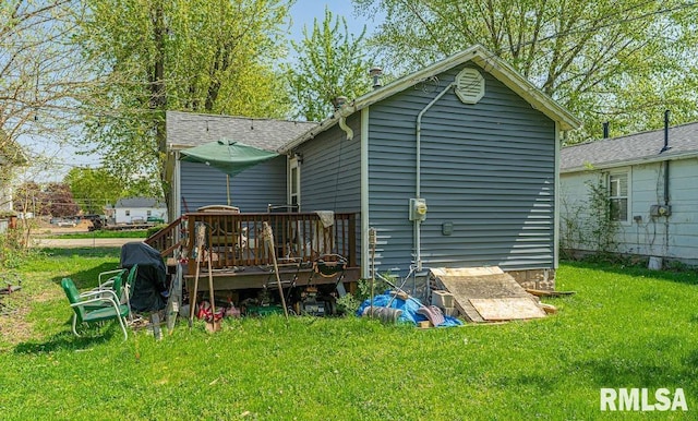1405 Pekin St, Lincoln, IL 62656 - back of house featuring a yard and a deck