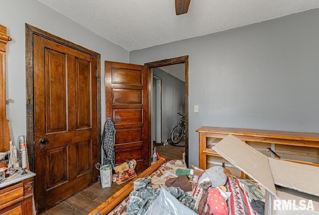 1405 Pekin St, Lincoln, IL 62656 - home office with ceiling fan, a textured ceiling, and wood finished floors
