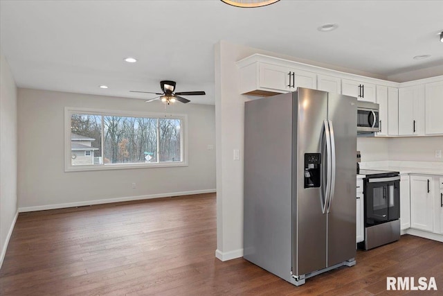 kitchen featuring ceiling fan, appliances with stainless steel finishes, dark hardwood / wood-style flooring, and white cabinets