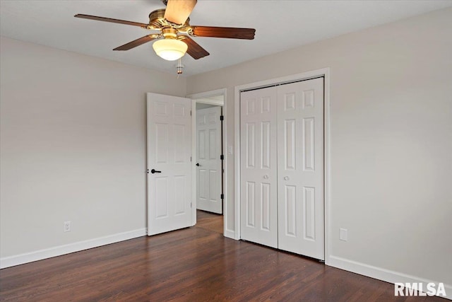 unfurnished bedroom featuring ceiling fan, dark hardwood / wood-style floors, and a closet