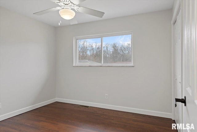 unfurnished bedroom featuring dark wood-type flooring, ceiling fan, and a closet