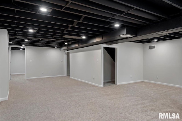 basement with light colored carpet