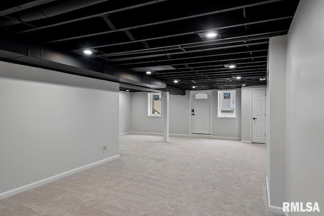 basement featuring carpet flooring