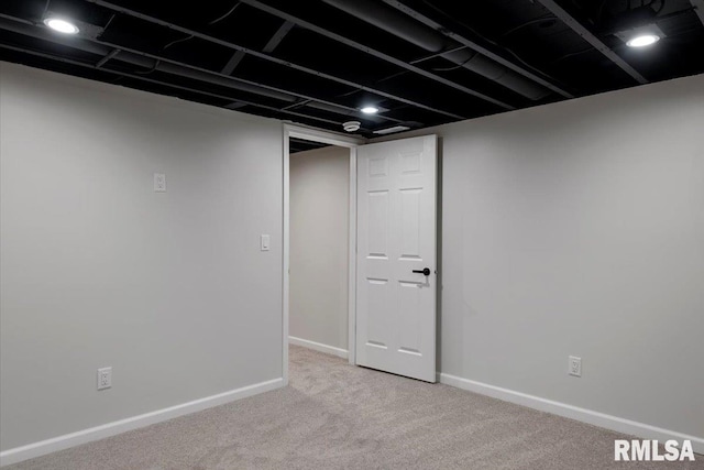 basement with light colored carpet