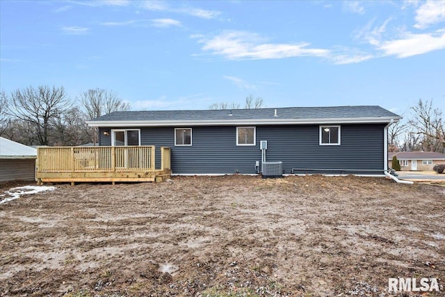 back of house featuring a wooden deck and central air condition unit