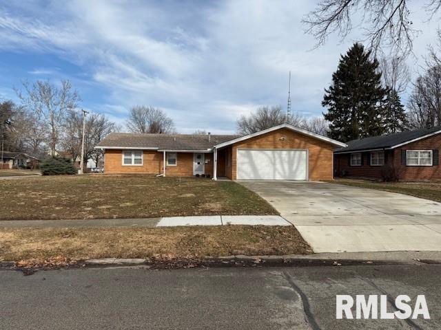 single story home featuring a garage and a front lawn