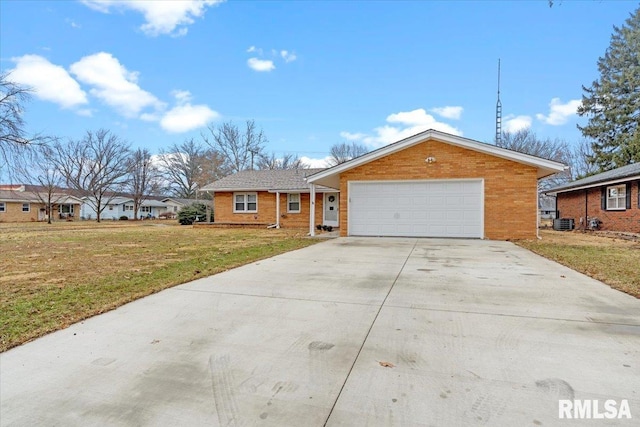 single story home with a garage, central AC unit, and a front yard