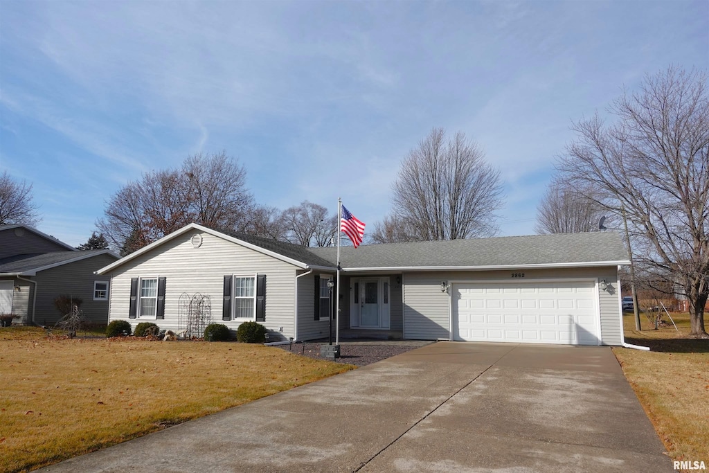 ranch-style home featuring a garage and a front yard