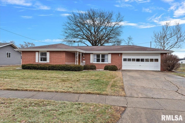 ranch-style house featuring a garage and a front yard