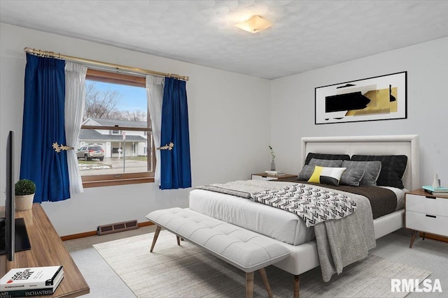 bedroom featuring light colored carpet