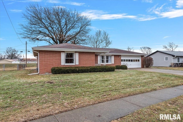 ranch-style house featuring a garage and a front lawn