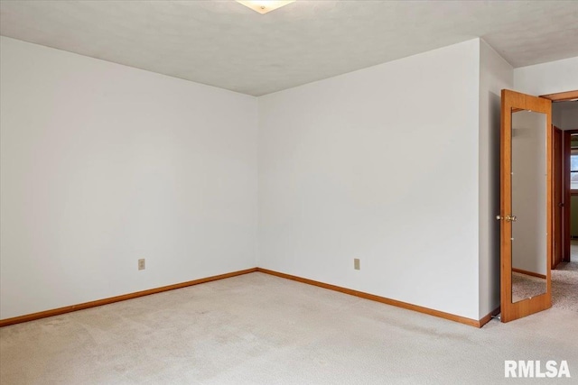 spare room featuring carpet