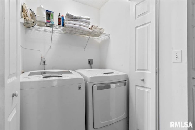 washroom featuring washing machine and dryer