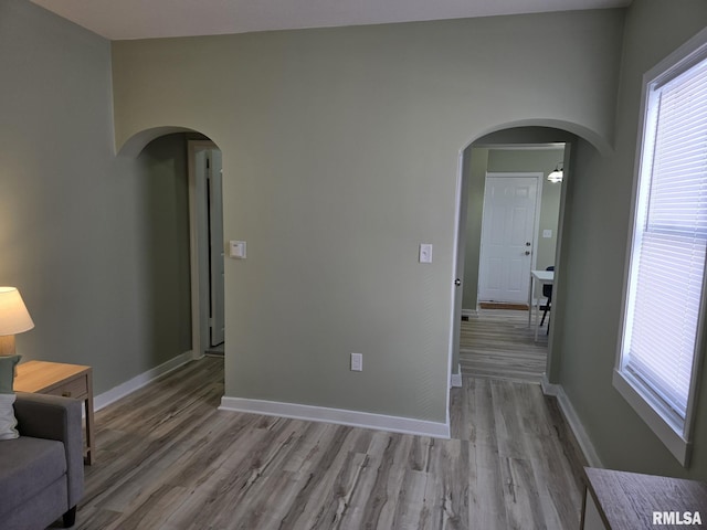 spare room with light hardwood / wood-style flooring