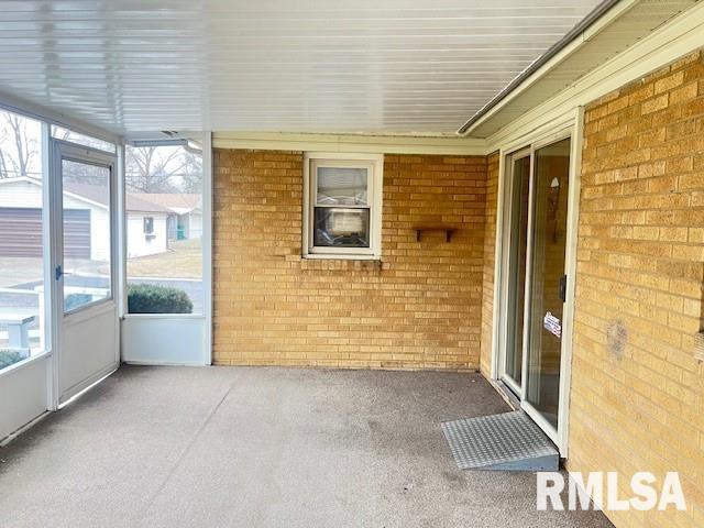 unfurnished sunroom with plenty of natural light