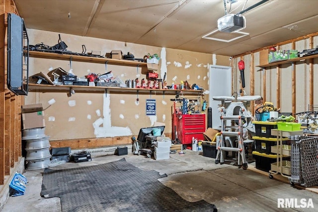 garage featuring a garage door opener and a workshop area