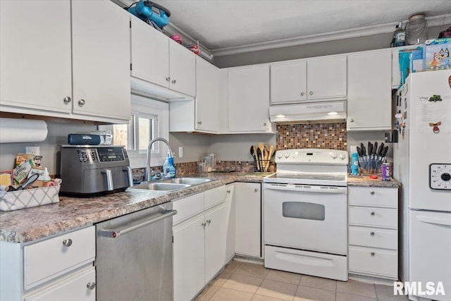 kitchen with sink, white cabinets, light tile patterned floors, crown molding, and white appliances