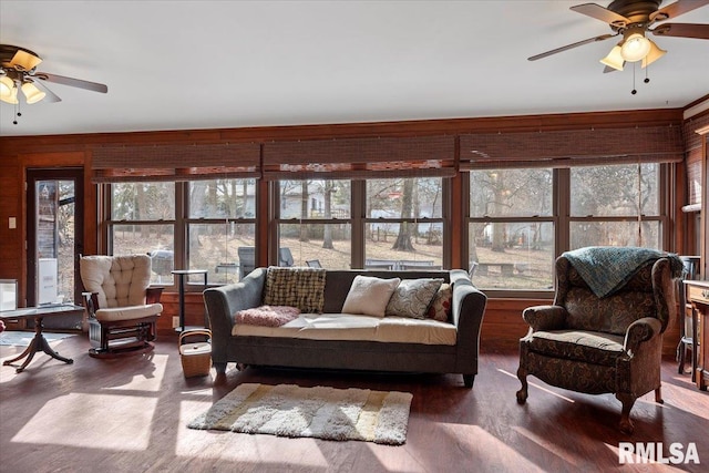 living room with hardwood / wood-style flooring and ceiling fan