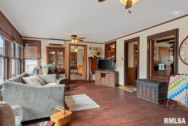 living room featuring a wall mounted air conditioner, crown molding, dark hardwood / wood-style floors, and ceiling fan