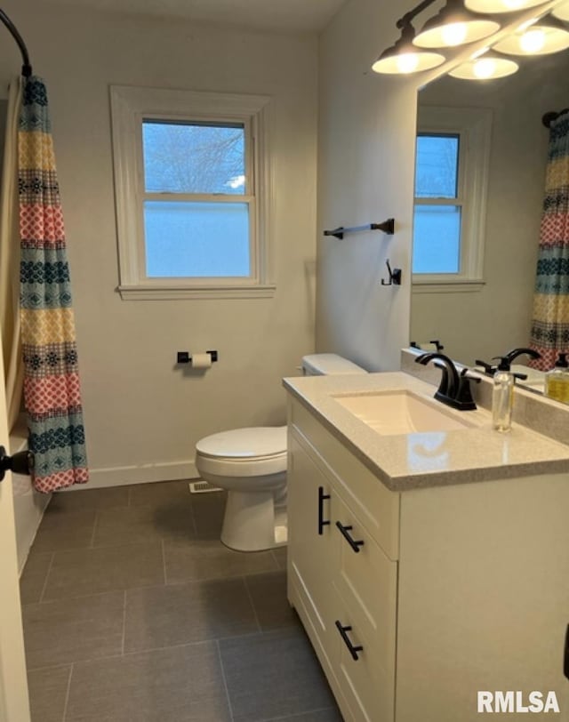 full bathroom featuring vanity, toilet, a healthy amount of sunlight, and shower / bath combo with shower curtain