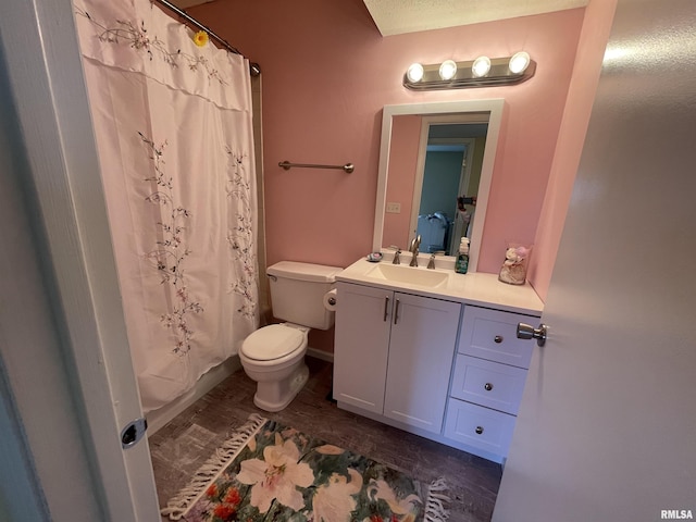 bathroom with vanity, toilet, and wood-type flooring