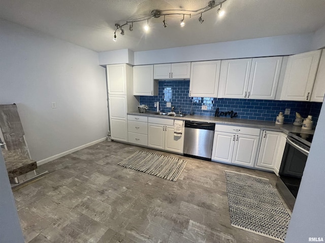 kitchen featuring sink, appliances with stainless steel finishes, white cabinetry, backsplash, and wood-type flooring