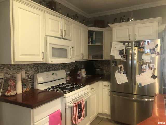 kitchen featuring white cabinetry, crown molding, white appliances, tile patterned flooring, and decorative backsplash