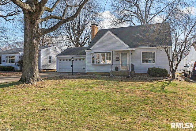 view of front of property featuring a garage and a front lawn