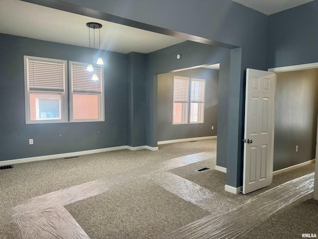 empty room featuring carpet floors