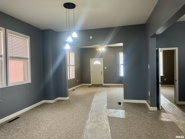 entrance foyer with carpet flooring