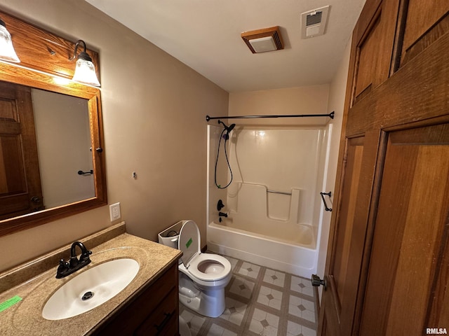 full bathroom with washtub / shower combination, vanity, and toilet