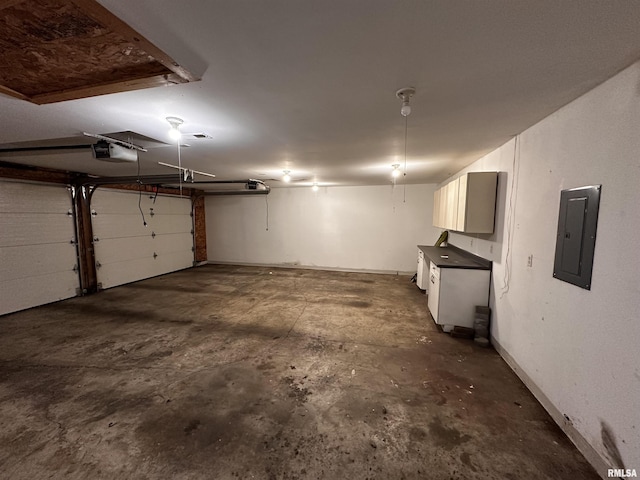 garage featuring a garage door opener and electric panel