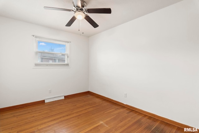 spare room with hardwood / wood-style floors