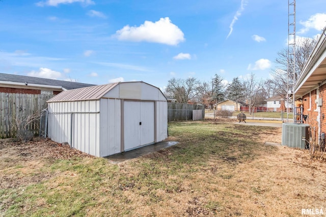 view of yard with cooling unit and a storage shed