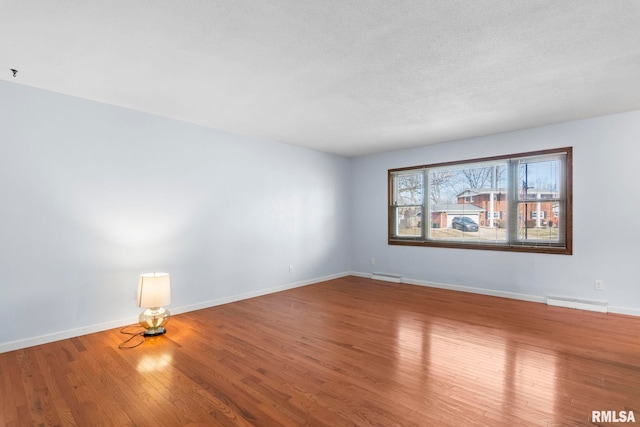 empty room with wood-type flooring