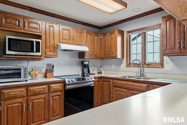 kitchen featuring stainless steel appliances, ornamental molding, and sink