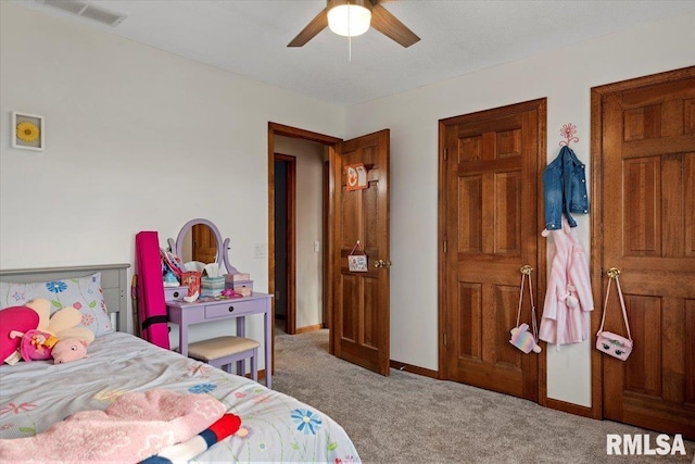 carpeted bedroom featuring ceiling fan