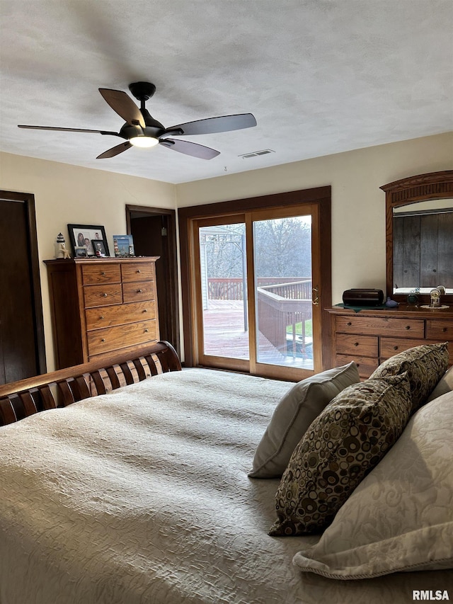 bedroom with access to exterior and ceiling fan