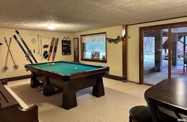 rec room with a textured ceiling, baseboards, billiards, and light colored carpet