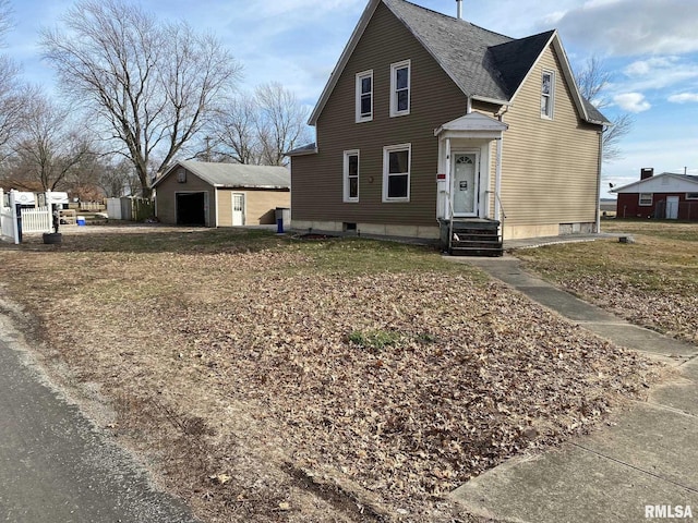 view of front of home with an outbuilding and a detached garage