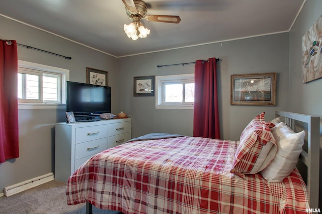 carpeted bedroom featuring multiple windows, ceiling fan, and baseboard heating