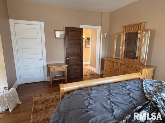 bedroom featuring dark wood-type flooring