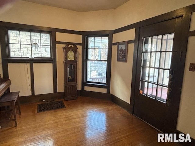 2340 Maine St, Quincy, IL 62301 - foyer entrance featuring plenty of natural light, wood finished floors, and baseboards