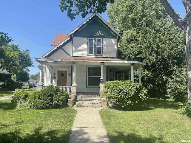 view of front of property featuring a porch and a front yard