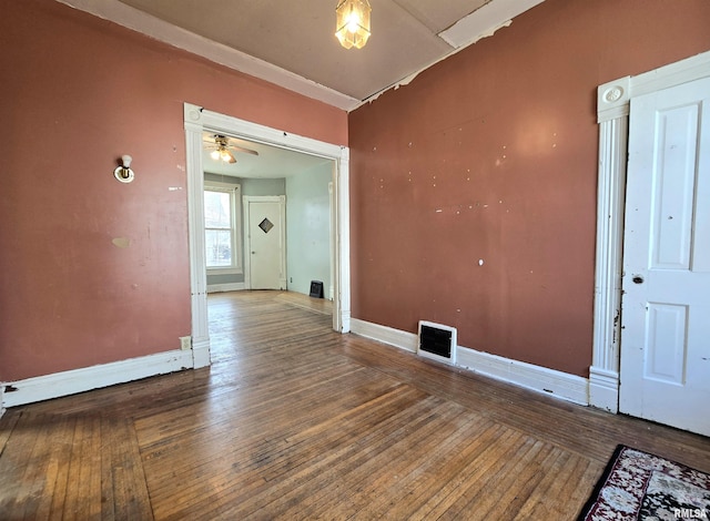 spare room featuring wood-type flooring