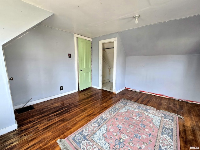 bonus room featuring hardwood / wood-style floors and vaulted ceiling