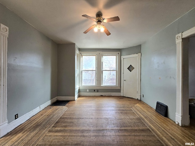 spare room featuring ceiling fan and wood-type flooring