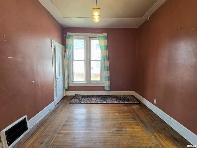 empty room with dark wood-type flooring