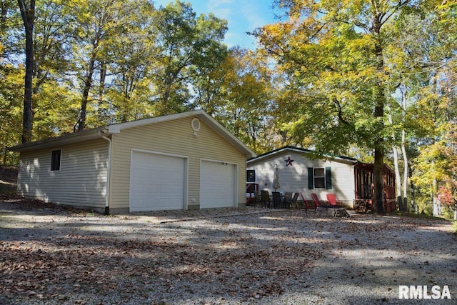 view of front of home with an outbuilding and a garage